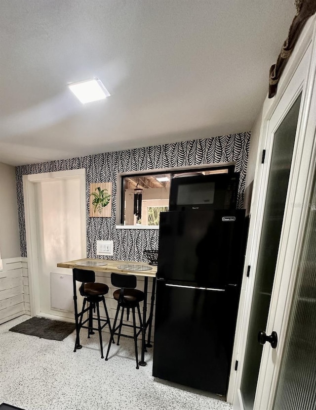 kitchen with black fridge