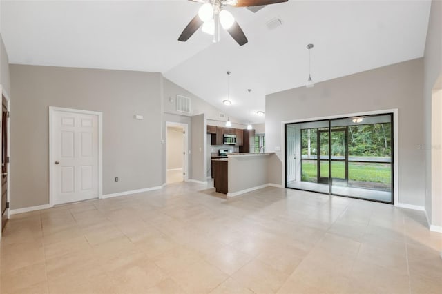 unfurnished living room with ceiling fan and high vaulted ceiling