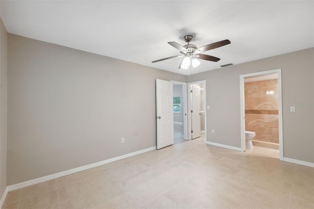 unfurnished bedroom featuring ensuite bathroom and ceiling fan