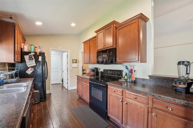 kitchen featuring sink and black appliances