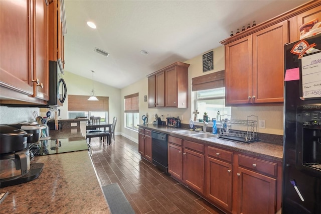 kitchen featuring black appliances, decorative light fixtures, a healthy amount of sunlight, and sink