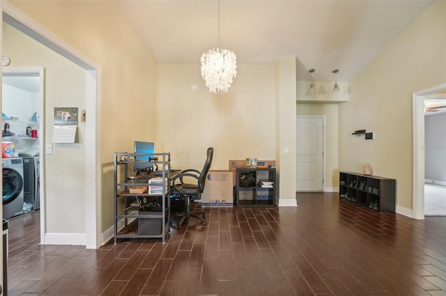 interior space with washing machine and clothes dryer and a notable chandelier