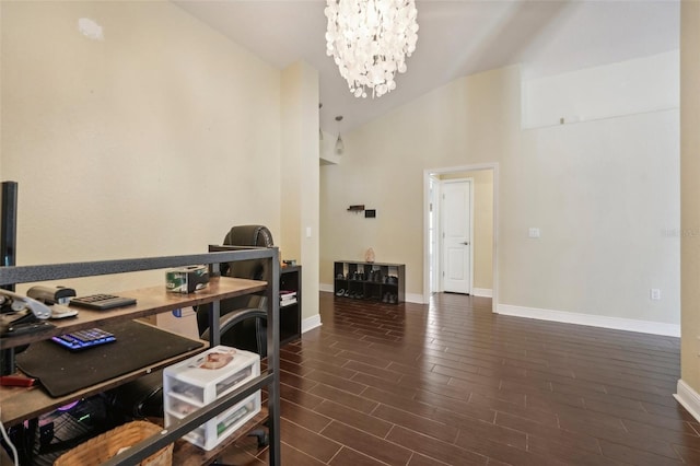 home office featuring a chandelier and lofted ceiling