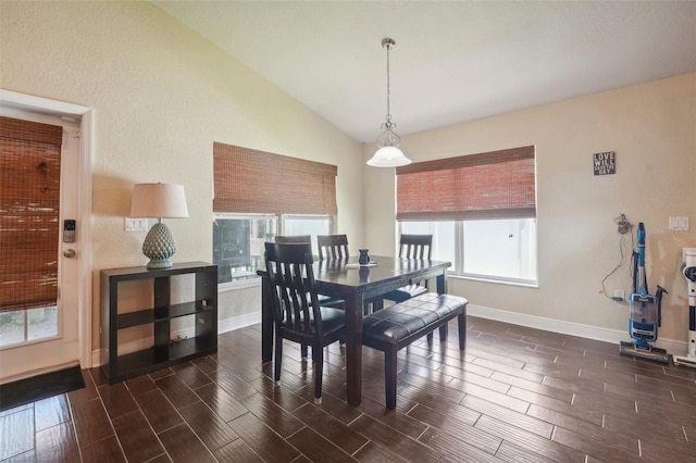 dining room featuring lofted ceiling