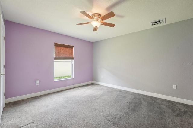 empty room with carpet floors and ceiling fan