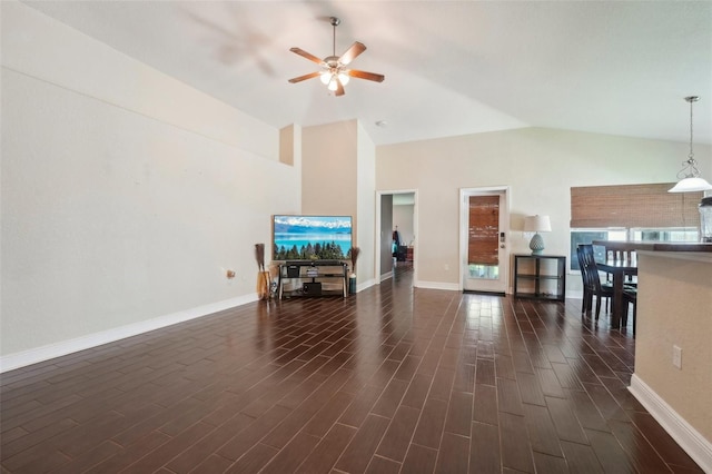 unfurnished living room with ceiling fan and lofted ceiling