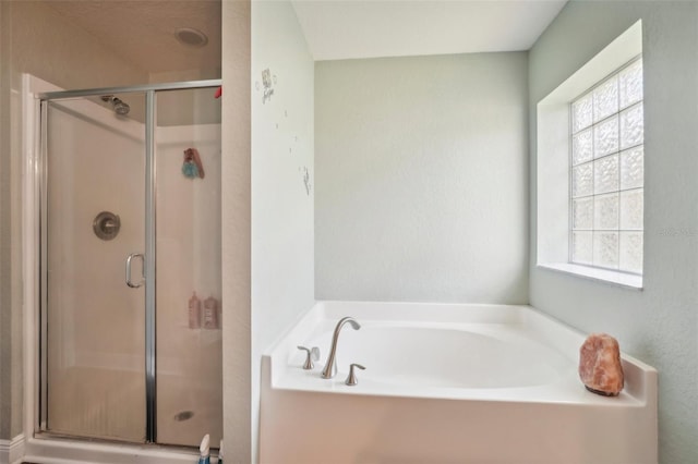 bathroom with separate shower and tub