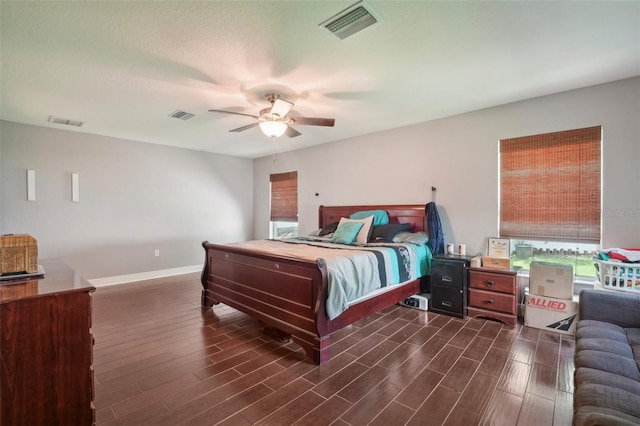 bedroom with ceiling fan and dark wood-type flooring