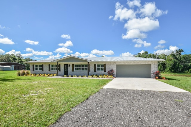 ranch-style home with a garage and a front lawn