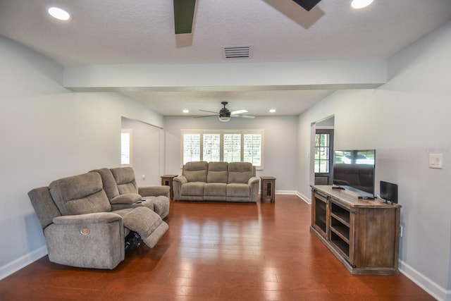 living room featuring hardwood / wood-style flooring, a textured ceiling, and ceiling fan