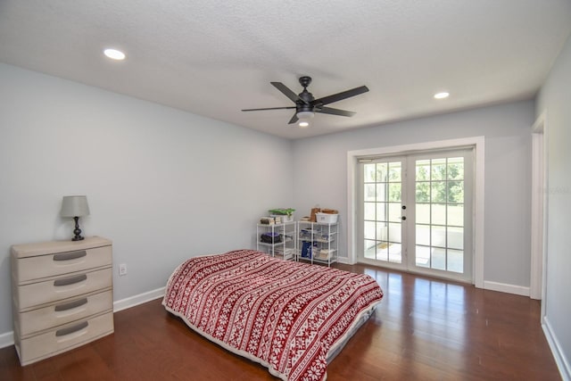 bedroom with french doors, a textured ceiling, access to outside, dark hardwood / wood-style flooring, and ceiling fan