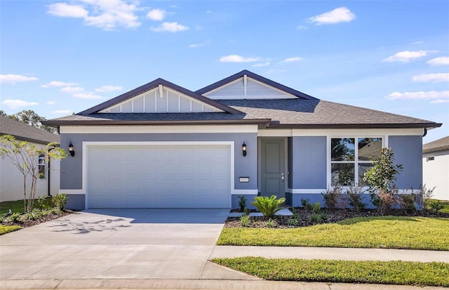 view of front facade featuring a front yard and a garage