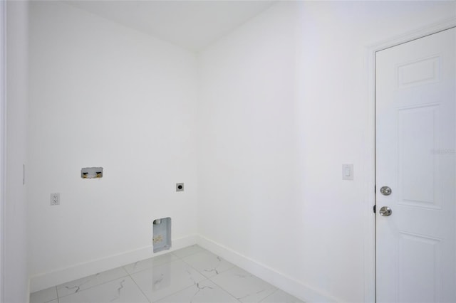 laundry area with hookup for an electric dryer, marble finish floor, laundry area, and baseboards