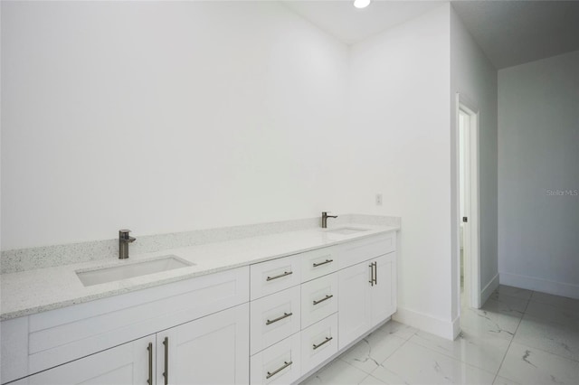 bathroom with vanity and tile patterned flooring