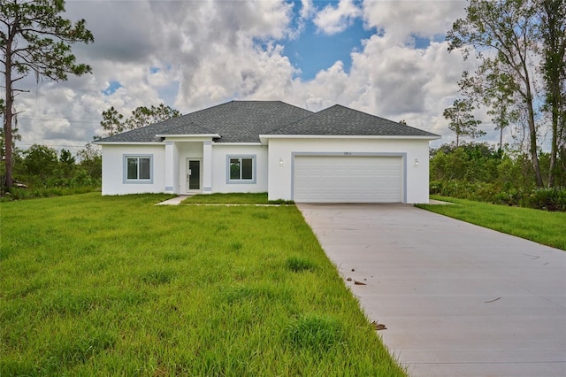 view of front of house with an attached garage, concrete driveway, a front yard, and stucco siding