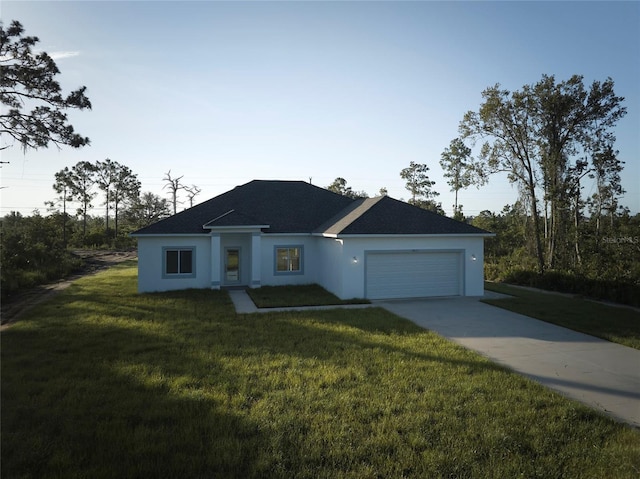 single story home with a garage, stucco siding, driveway, and a front lawn