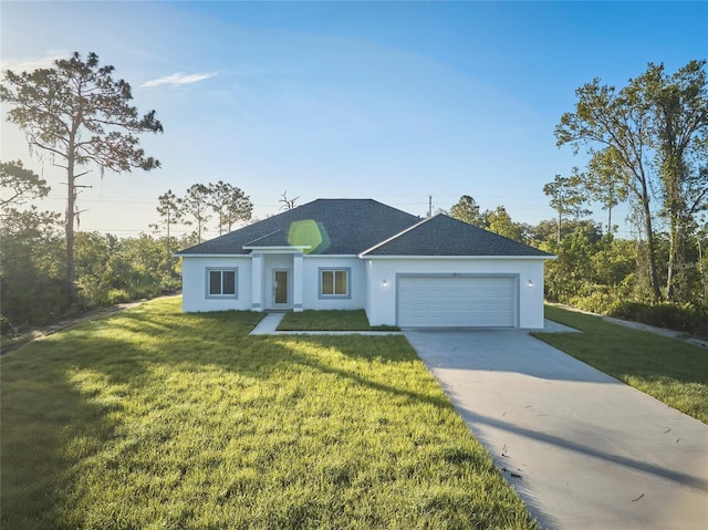 ranch-style home featuring a front yard, a garage, stucco siding, driveway, and roof with shingles