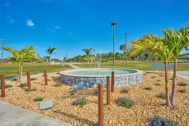 view of home's community with a lawn