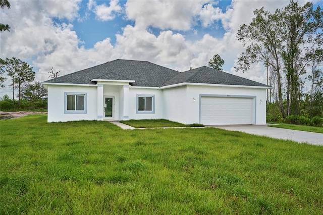 view of front of house with a garage and a front yard