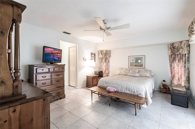 tiled bedroom with ceiling fan