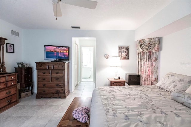 tiled bedroom with ceiling fan