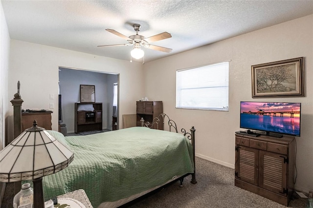 bedroom with a textured ceiling, ceiling fan, and carpet floors