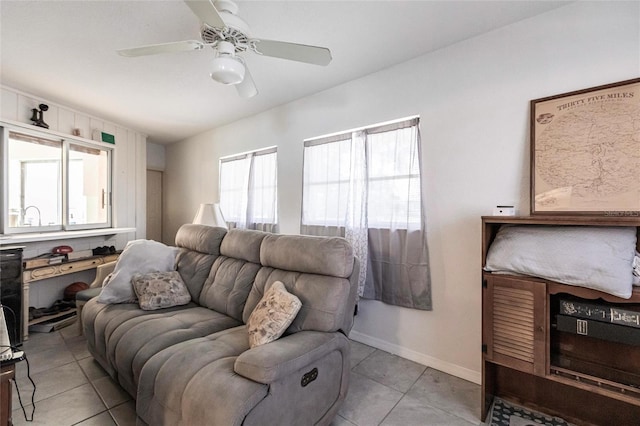 tiled living room featuring ceiling fan