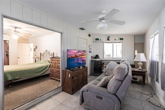 bedroom featuring ceiling fan and light tile floors