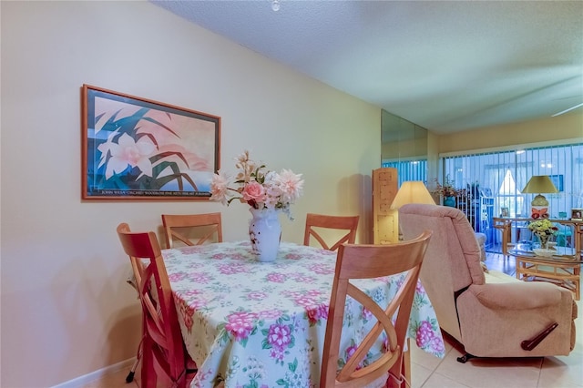 3283 Hilary Cir Unit 2C, Palm Harbor, FL 34684 - dining space with baseboards and tile patterned flooring