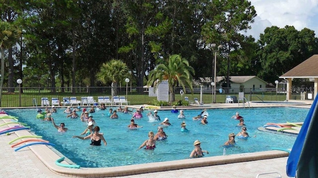 3283 Hilary Cir Unit 2C, Palm Harbor, FL 34684 - community pool featuring fence