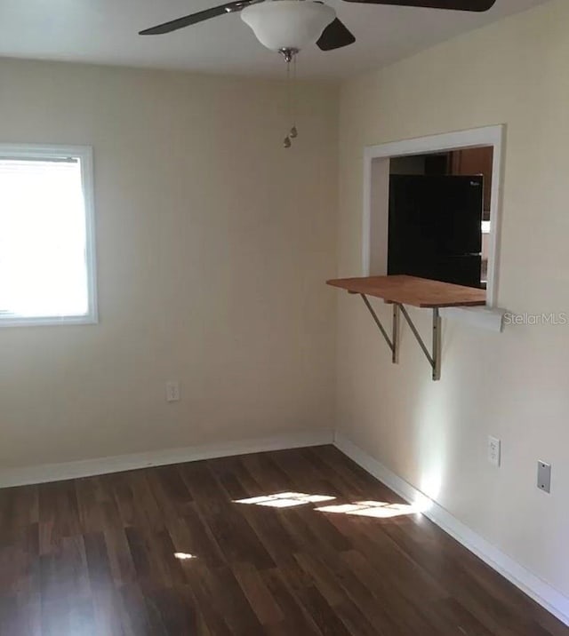 empty room with wood-type flooring and ceiling fan