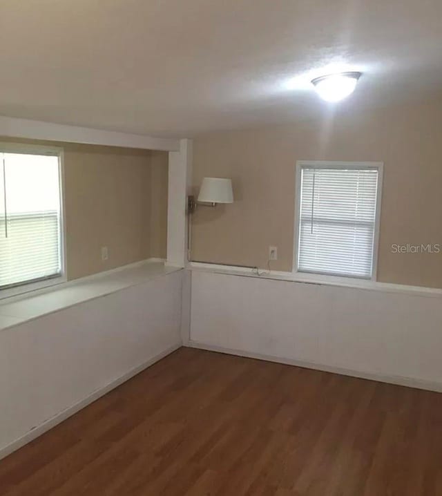 unfurnished room featuring wood-type flooring