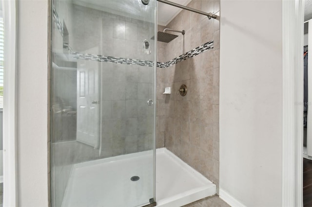 bathroom with tiled shower