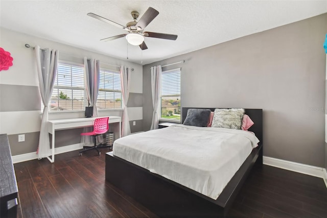 bedroom featuring dark hardwood / wood-style flooring and ceiling fan