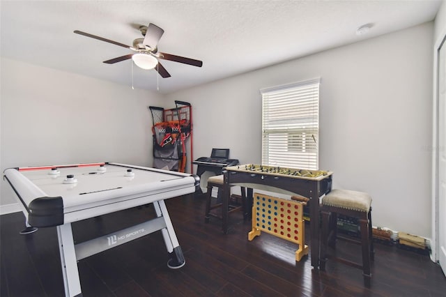 game room with dark hardwood / wood-style flooring and ceiling fan