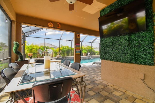 sunroom with ceiling fan and a pool