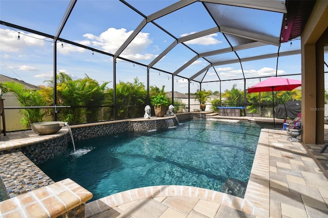 view of pool with glass enclosure, pool water feature, and a patio