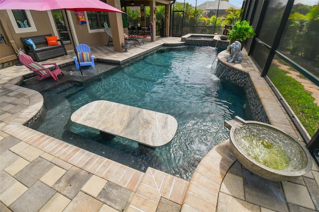 view of pool with a patio, a lanai, and a pool with connected hot tub