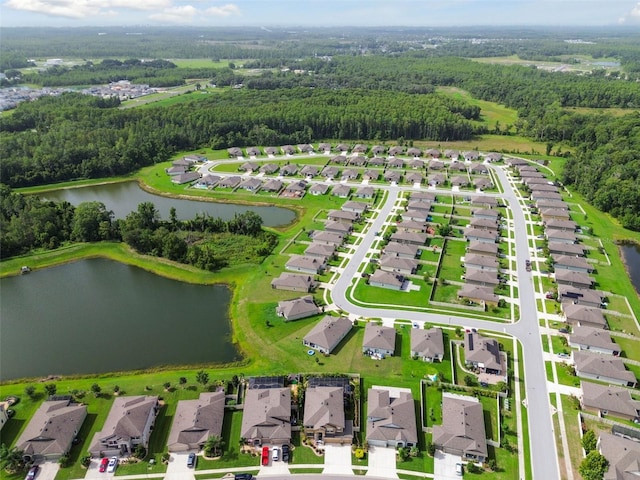 bird's eye view featuring a water view, a residential view, and a view of trees