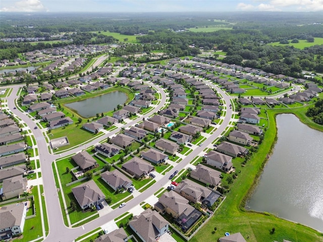 birds eye view of property featuring a residential view and a water view