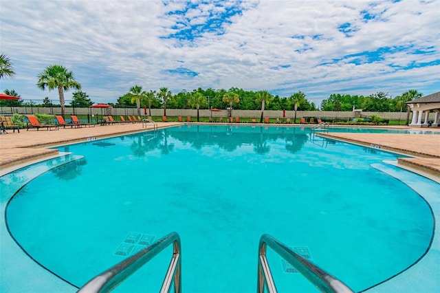 view of swimming pool featuring a patio area