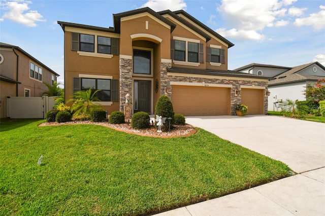 view of front of house featuring fence, stone siding, concrete driveway, stucco siding, and a front yard