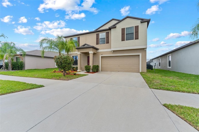 view of front facade with a garage and a front yard