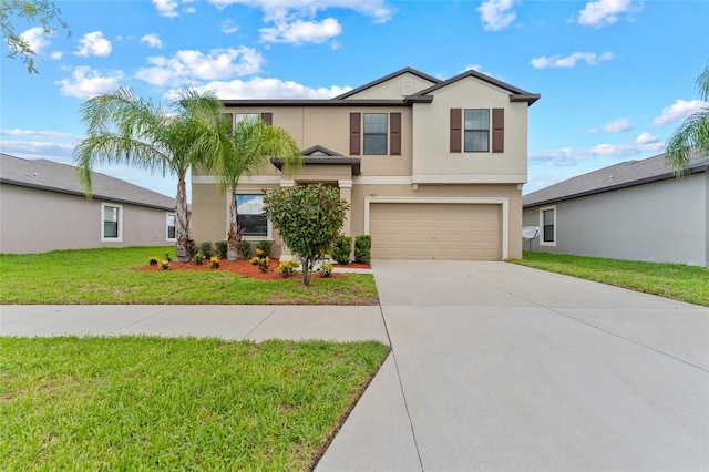 view of property with a front yard and a garage