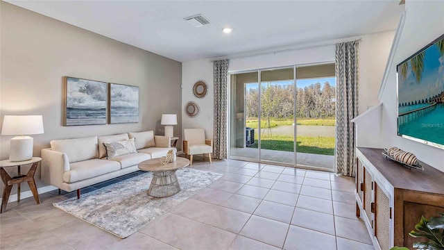 living area with light tile patterned flooring and visible vents