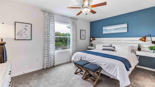 bedroom with baseboards, carpet floors, and ceiling fan