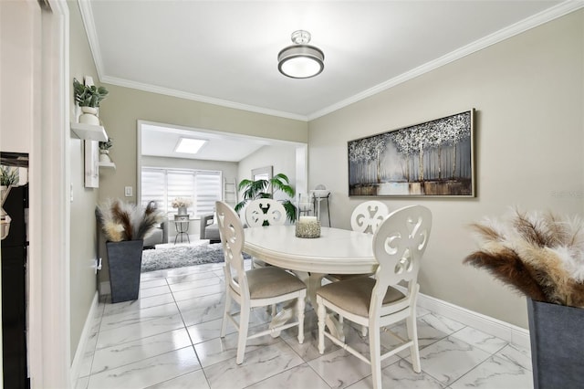 dining space featuring crown molding