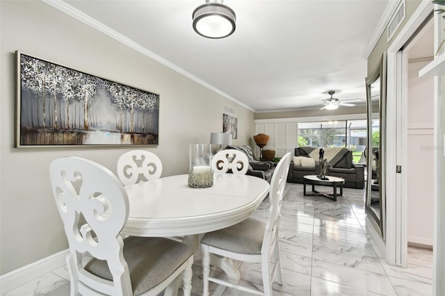 dining area featuring ceiling fan and crown molding