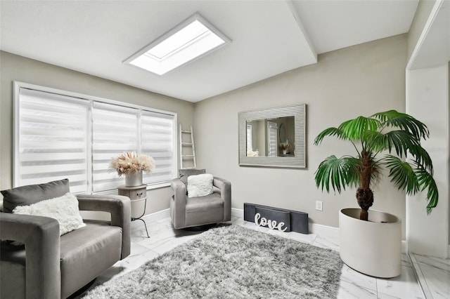 living room featuring a skylight