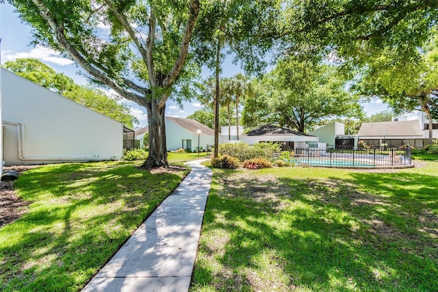 view of yard featuring a fenced in pool